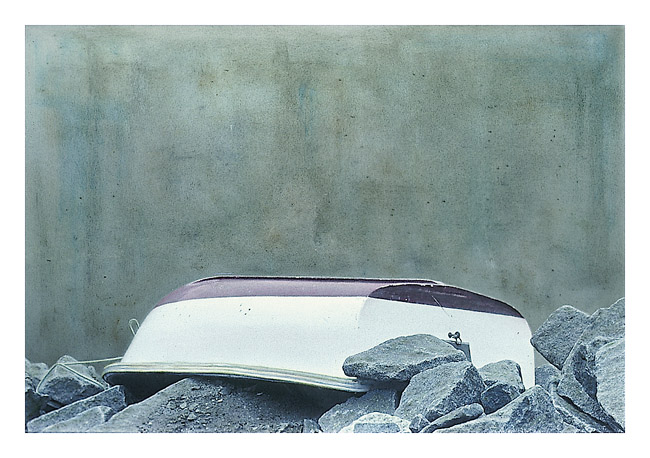 Boat with Rocks and Concrete Wall