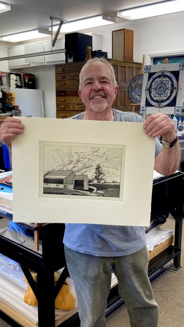 Chuck Bauer with freshly pulled etching proof