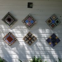 Six mosaic medallions outside